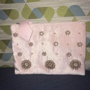 NWOT. Soft pink velvet makeup bag and/or clutch.